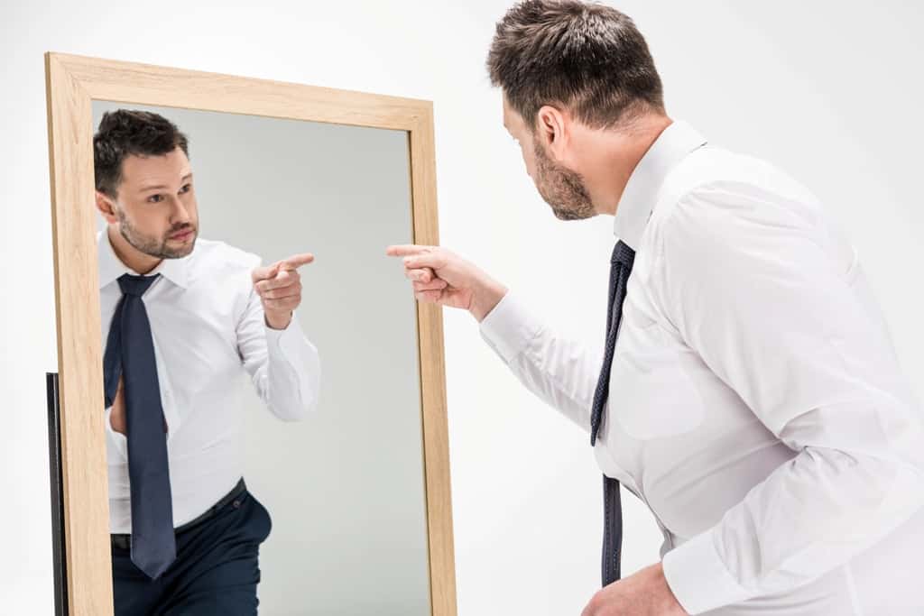 A man and his reflection in the mirror