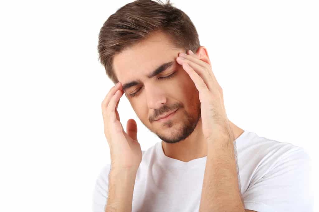 a young man with headache