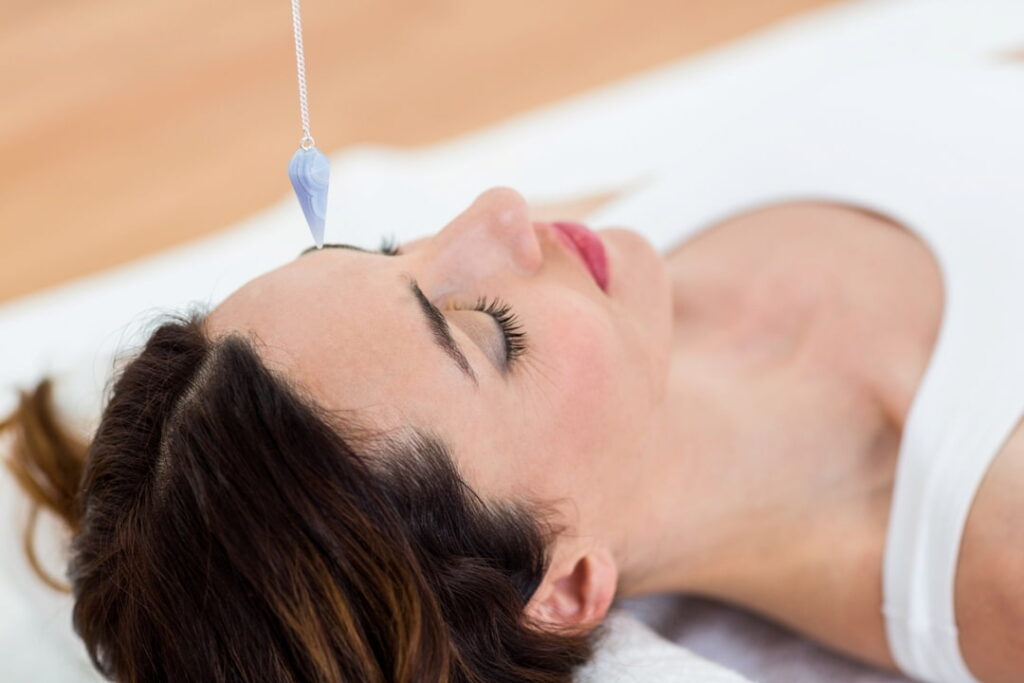 a woman with her eyes closed lying on the floor