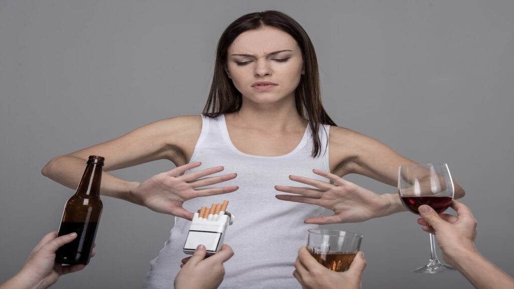 a girl saying no to offered drinks and cigarettes