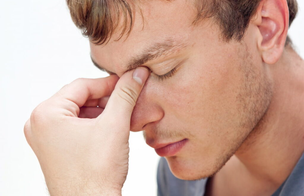 a young man in a concentrating pose