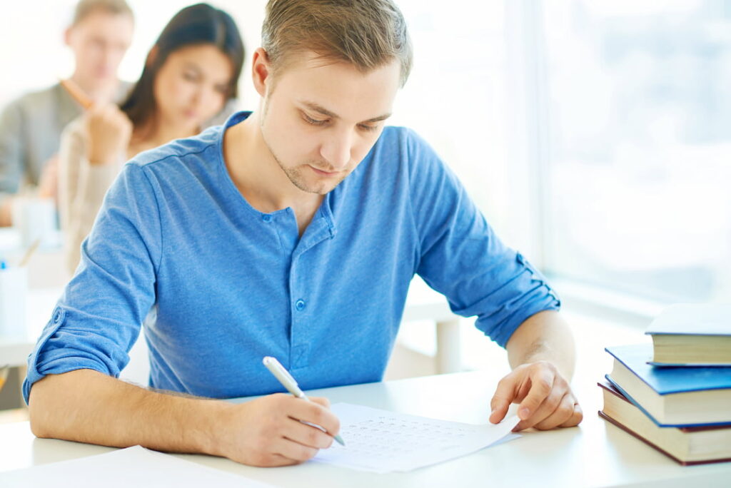 students in the classroom taking an exam