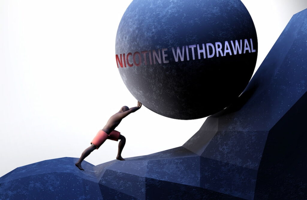 a person pushing weight with word Nicotine withdrawal