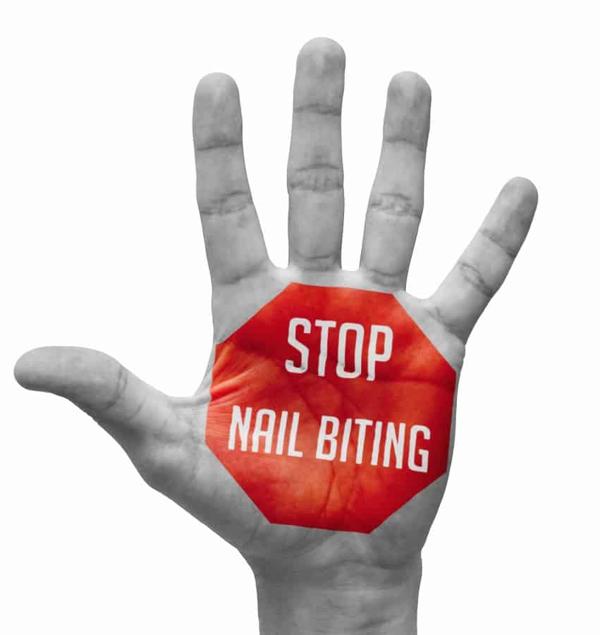 Stop Nail Biting sign written on the palm