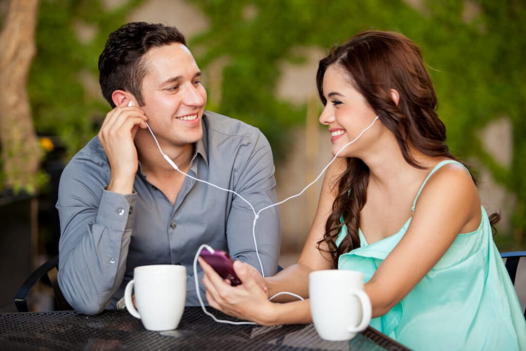 a young couple listening to music together