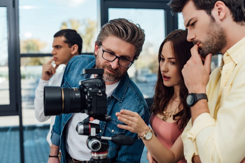 a man showing his work to colleagues