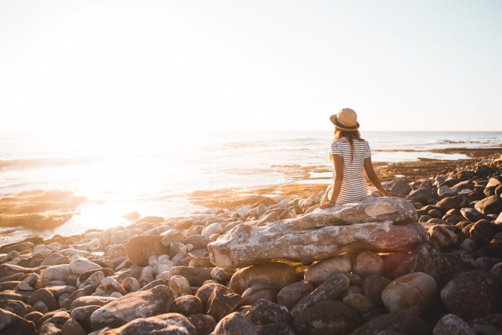 a girl watching a sunset