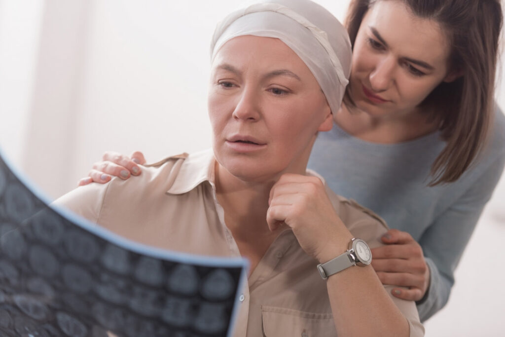 a sick woman holding the scan