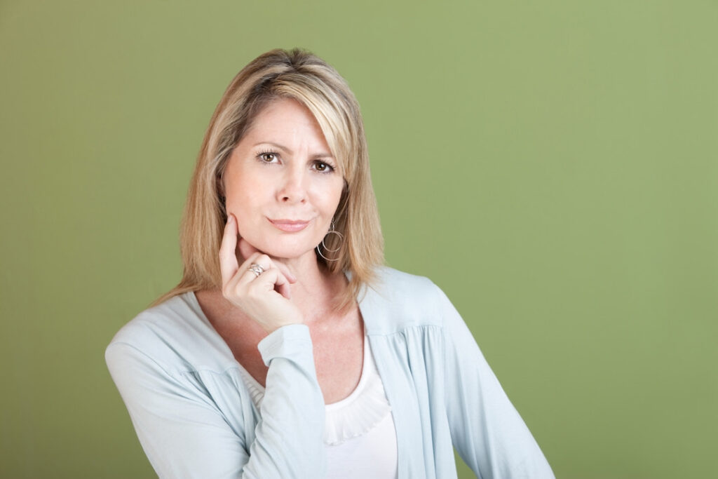 mature blonde woman with skeptical face