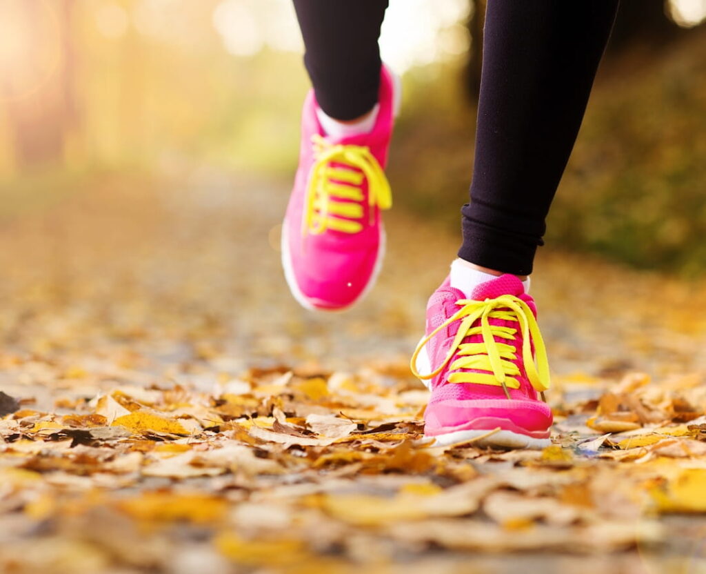 closeup of a female person's legs during the walk outdoors