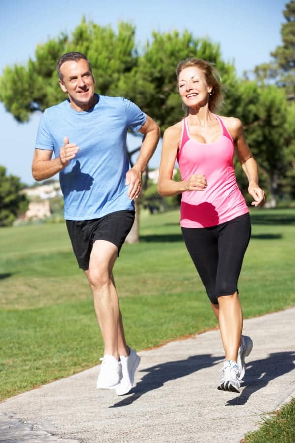 a man and a woman jogging outdoor