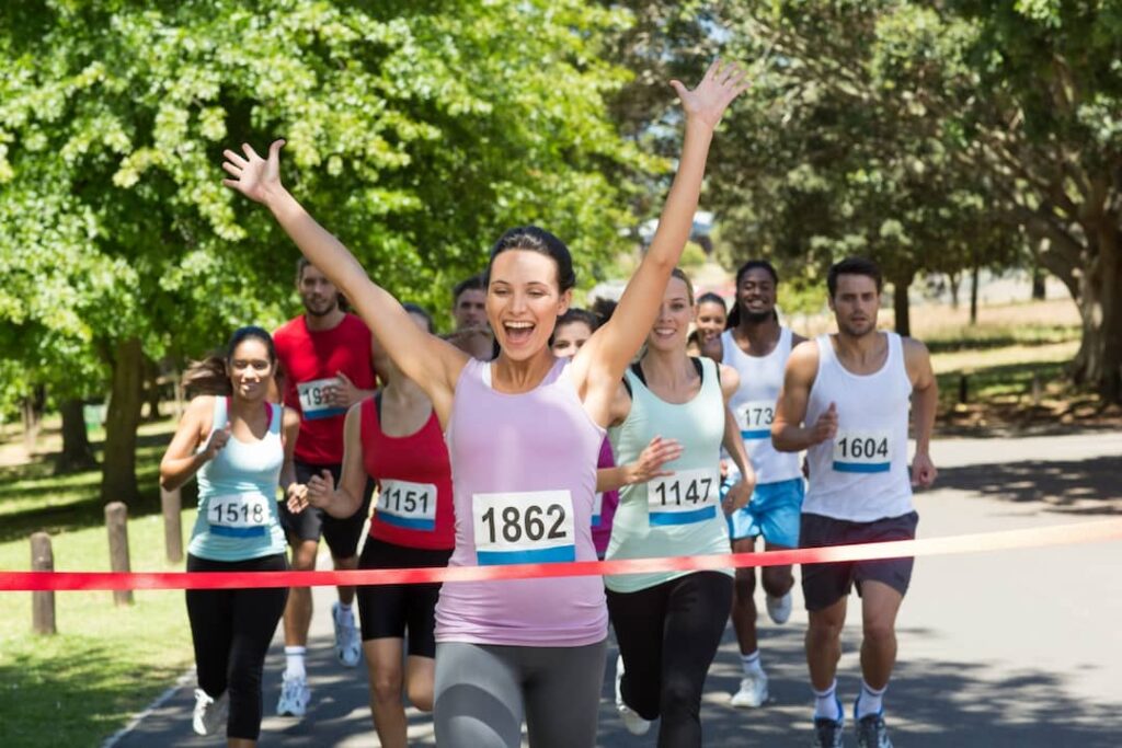 a group of people running in the park