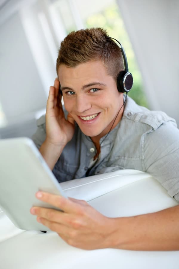 a young man listening self-hypnosis audio