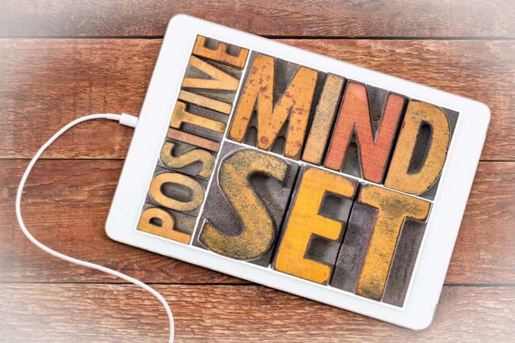 positive mindset concept with words framed in tablet display