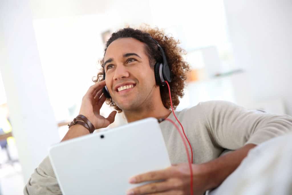 young man practicing self-hypnosis with audio downloads