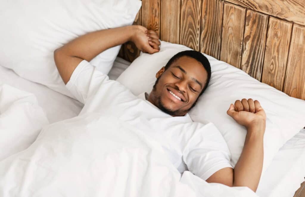 a man sleeping in the bed