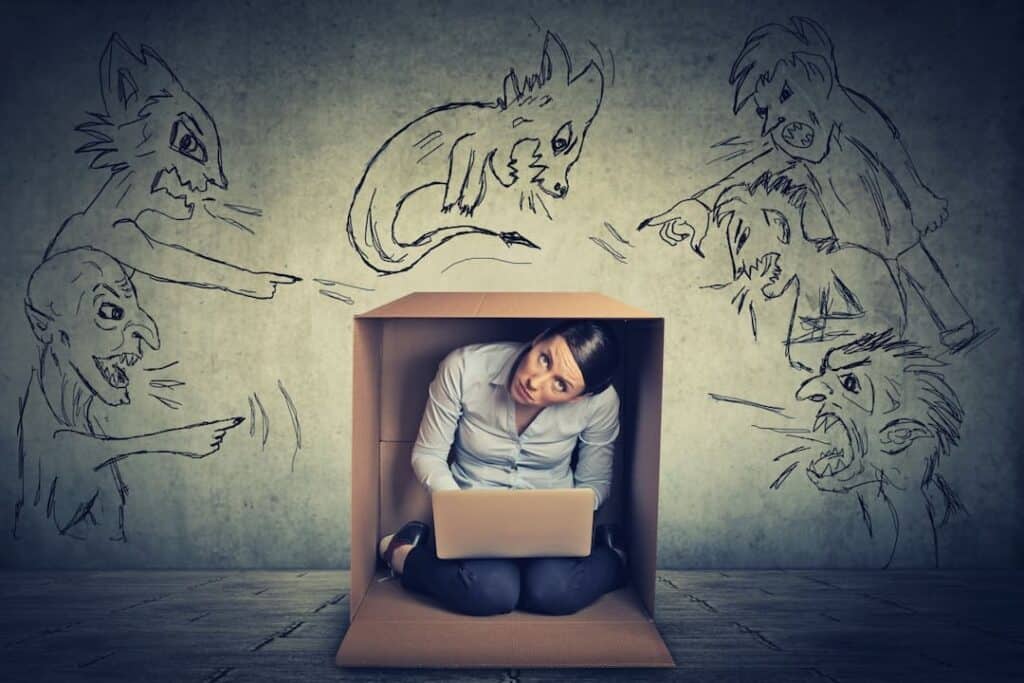 a stressed woman sitting in a box