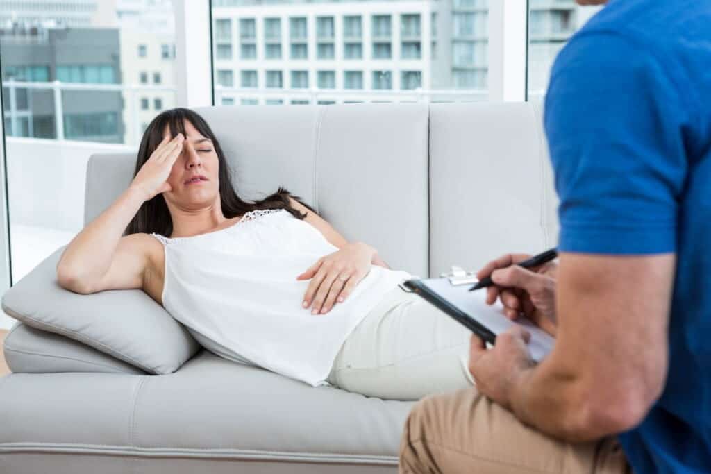 a woman on the hypnosis session