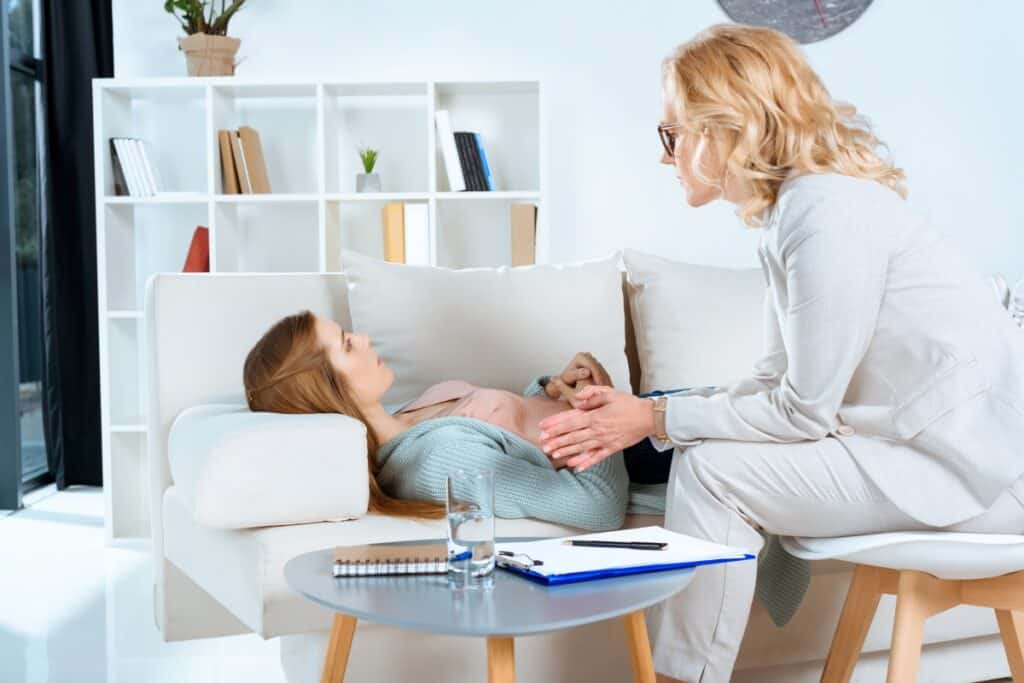 a woman on the hypnotherapy session