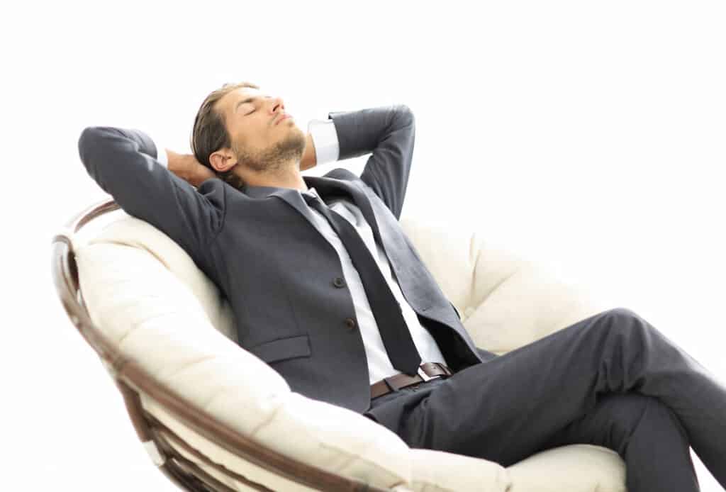 a man practicing self-hypnosis in an armchair