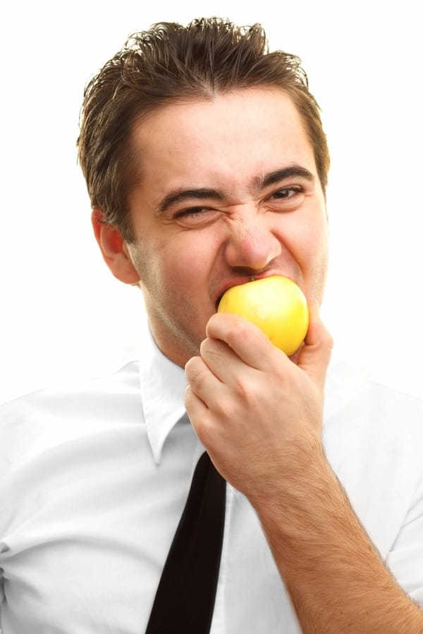 a man eating an apple