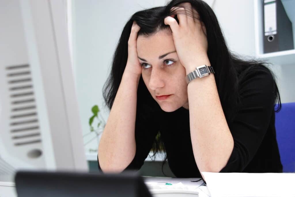 a woman loosing her focus while working 