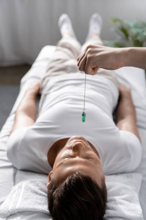 a man lying down during the hypnosis session