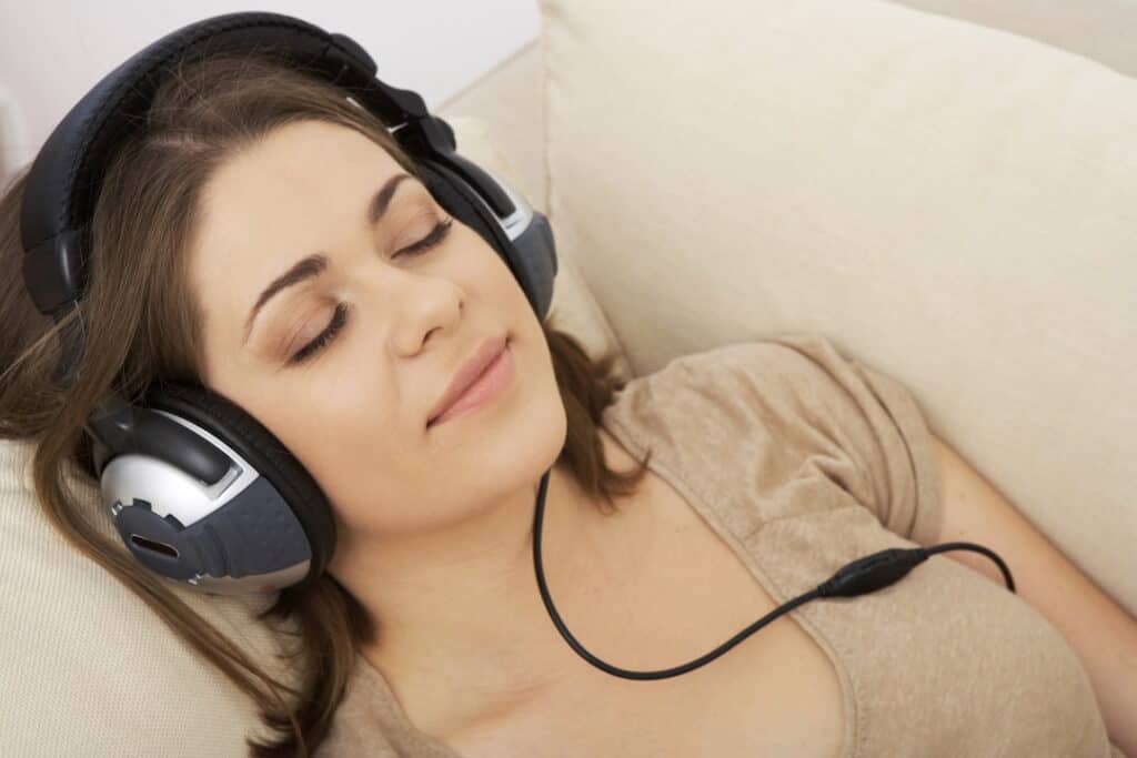 a woman listening to guided hypnosis