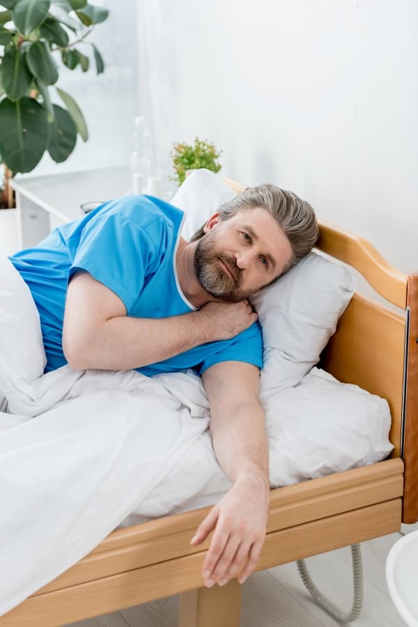 a man lying in the bed