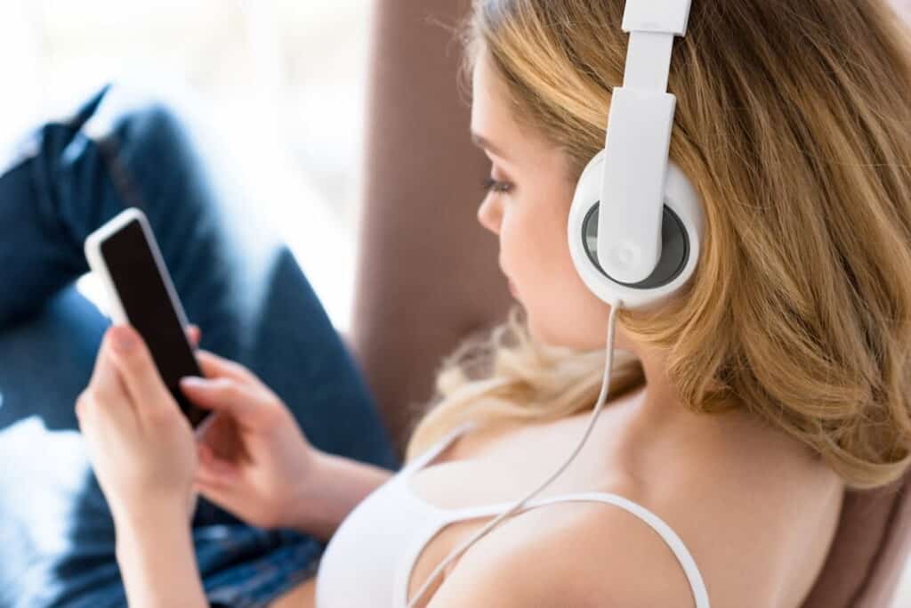 woman with headphones and cellphone