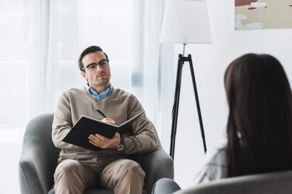 hypnotherapist on the session with his patient