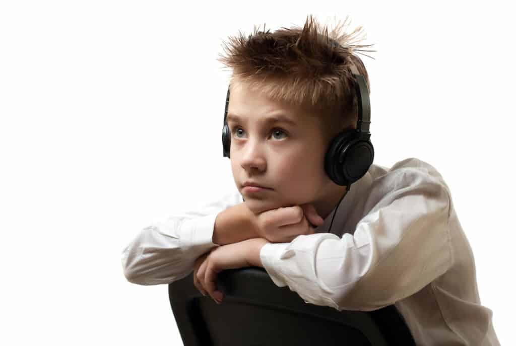 a boy listening to audio downloads 