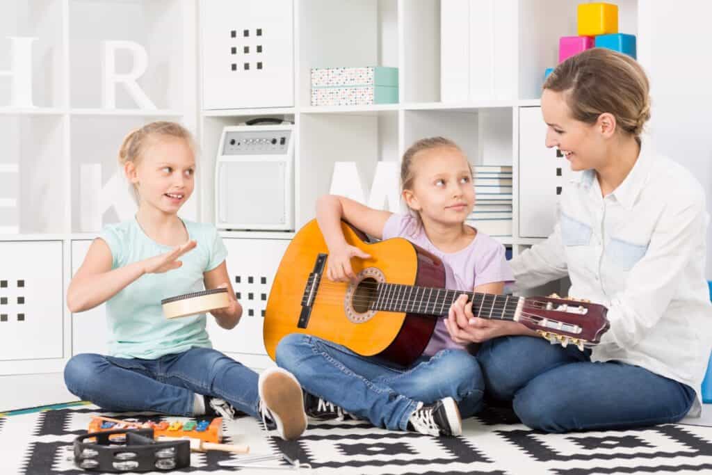 Mother supporting her children in playing