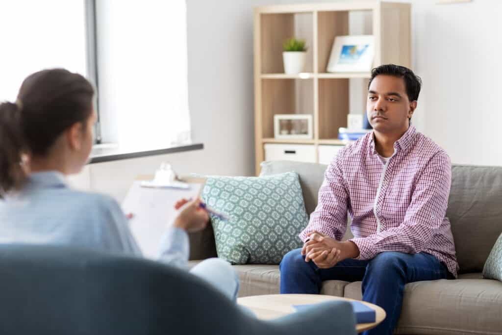 a hypnotherapist and the patient in the office