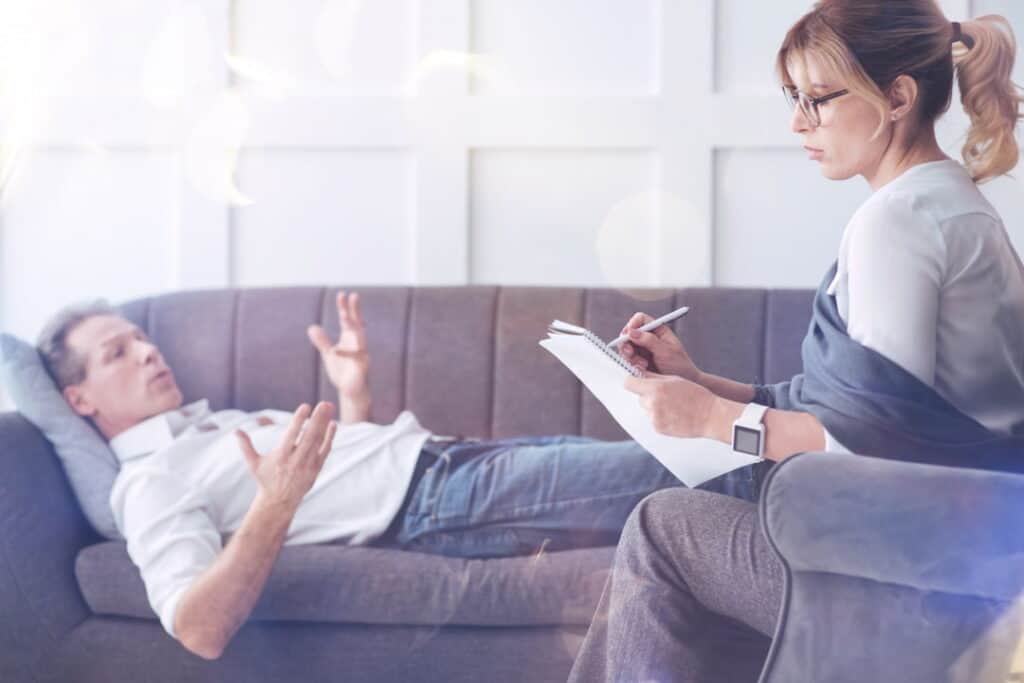 a man lying on the couch during the hypnotherapy