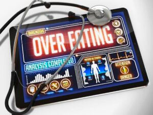 a medical report about overeating on tablet display