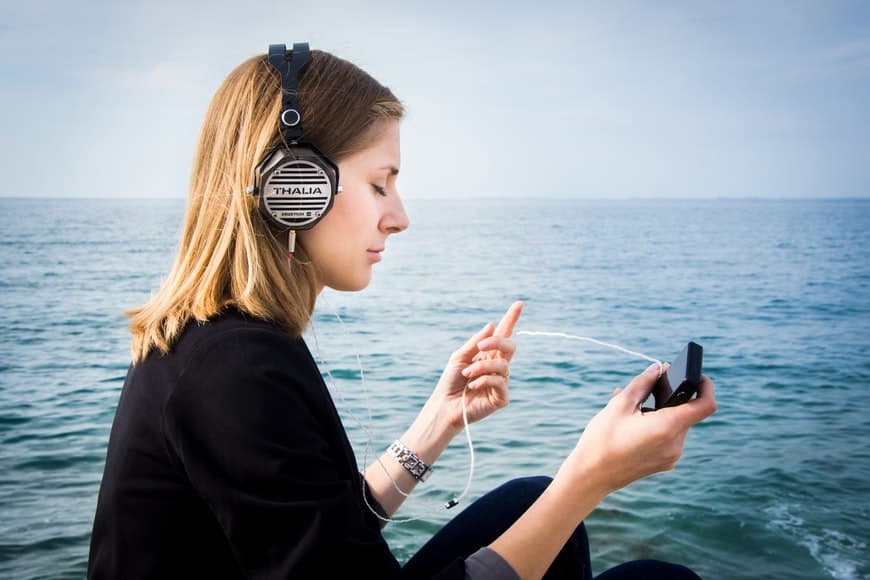 a woman with headphones meditating