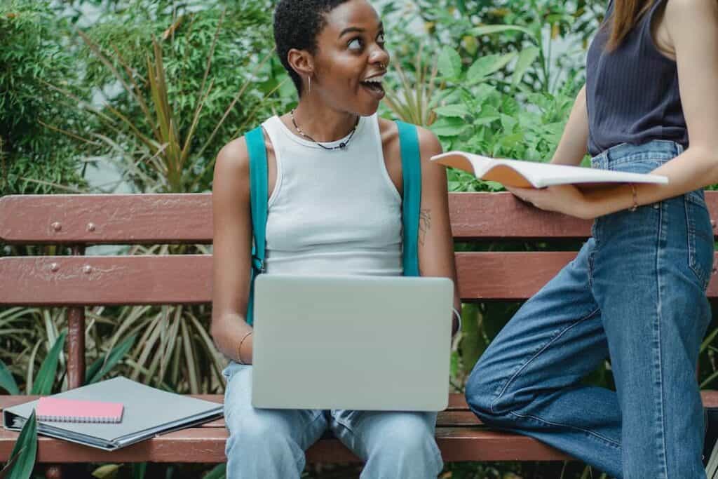 two friends chatting on the bench